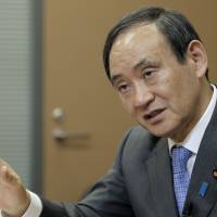 Chief Cabinet Secretary Yoshihide Suga makes a point during an interview in Tokyo. Government has no plans to issue deficit bonds to fund planned stimulus package: Suga