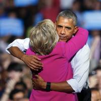 President Barack Obama embraces Democratic presidential candidate Hillary Clinton during a campaign rally for Clinton Tuesday in Charlotte, North Carolina. | AP