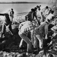 FBI agents search a bank of the Columbia River for additional money or clues in the D.B. Cooper skyjacking case in Vancouver, Washington, in February 1980. | AP