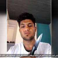 An image from an undated video the Islamic State group posted Tuesday shows the Afghan refugee who allegedly attacked passengers with an ax on a train in Germany. | SOCIAL MEDIA VIA REUTERS TV