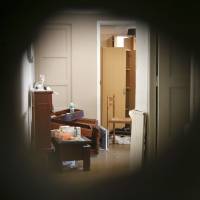 Mohamed Lahouaiej Bouhlel\'s apartment is seen through a hole in the wall made by police in Nice on Saturday. | AP