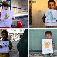 A combination photo shows boys holding pictures depicting Pokemon characters. The photos (clockwise from top right) show boys holding banners reading: \"I am from Kafr Naboudah, save me!\" \"I am in Kafr Nabl in rural Idlib, come and save me!\" \"I am in Eastern Ghouta in Syria, come and get me!\" and \"I am trapped in Douma in Eastern Ghouta, Help me.\" | REUTERS