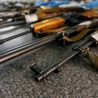Confiscated weapons are seen at a police station in Slovyansk, in Ukraine\'s Donetsk region, on June 30. | REUTERS