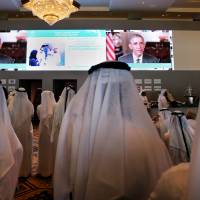 Emirati officials watch U.S. President Barack Obama’s keynote address at the opening ceremony of the World Government Summit in Dubai, United Arab Emirates, in February. A ‘special alert’ issued by the United Arab Emirates Embassy to Washington on Saturday urged citizens to stay away from demonstrations in U.S. cities, and Bahrain told nationals to be ‘cautious of protests or crowded areas.’ Three nations urge U.S.-bound travelers to be cautions, amid protests
