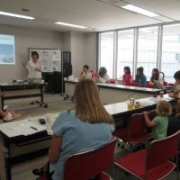 Kimura hosts a disaster-preparedness workshop in English in Tokyo in June 2013. | COURTESY OF WANAVI JAPAN