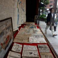 Old maps, ukiyo-e woodblock prints and books from the Edo Period are among valuable antiquarian items offered at the Oya bookstore in Tokyo’s Jinbocho district. | SATOKO KAWASAKI