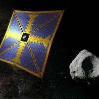A computer rendering shows what JAXA\'s solar sail may look like as it approaches an asteroid. The probe is at the sail\'s center. | JAPAN AEROSPACE EXPLORATION AGENCY