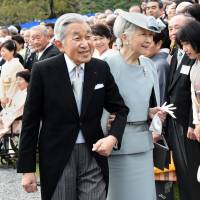 Emperor Akihito and Empress Michiko greet guests during the annual autumn garden party at the Akasaka Palace\'s Imperial garden in Tokyo last Nov. 12. | AFP-JIJI