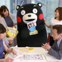 Kumamoto Prefecture\'s mascot character Kumamon promotes discount tours to the Kyushu region in Tokyo on July 14. | KYODO