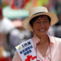 Actress Saya Takagi, a candidate for Shinto Kaikaku (New Renaissance Party), talks with voters in Tokyo\'s Sugamo district, an area popular with elderly people, on Monday. | REUTERS