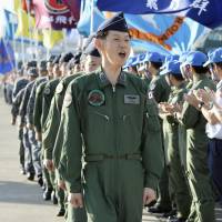 Air Self-Defense Force personnel prepare to board C-130 transport aircraft at Komaki Air Base in Aichi Prefecture on Monday before flying to South Sudan to evacuate Japanese citizens. | KYODO