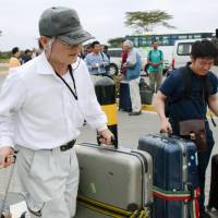 Japanese aid workers evacuated from South Sudan arrive in Nairobi on a chartered aircraft on Wednesday. | KYODO