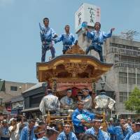 Celebrants on top of a float at the Gion Festival. | STEPHEN MANSFIELD
