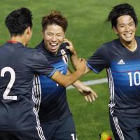 Takuma Asano (center) celebrates after scoring in the Japan Under-23 team\'s 4-1 win over South Africa on Wednesday. | KYODO