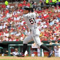 Miami Marlins\' Ichiro Suzuki follows through on a double during the sixth inning of a baseball game against the St. Louis Cardinals Sunday in St. Louis. | AP