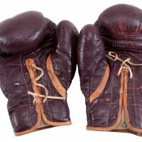 Boxing gloves worn by Muhammad Ali during his March 8, 1971, \"Fight of the Century\" in Madison Square Garden against Joe Frazier are pictured in this undated handout photo obtained by Reuters Monday. The gloves are set to be auctioned off in New Jersey Aug. 4. | GOLDIN AUCTIONS / HANDOUT VIA REUTERS