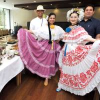 (from left): Senior Technical Officer of the Panama Consulate Samuel Guevara and his wife Adriana Nunez; Ayana Hatada, wife of the ambassador of Panama to Japan; and Charge d\'Affairs a.i. of Panama David De Leon pose during a Panama Day program promoting the country\'s history, culture and cuisine at the JICA Global Plaza in Tokyo on June 26. | YOSHIAKI MIURA