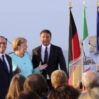 French President Francois Hollande (left), German Chancellor Angela Merkel and Italian Premier Matteo Renzi stand on the deck of the Italian aircraft carrier Garibaldi off Ventotene island\'s shores, Italy, Monday. The leaders of Italy, France and Germany headed Monday to one of the birthplaces of European unity in a symbolic bid to relaunch the European project following Britain\'s decision to leave the EU. | AP