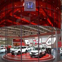 Honda vehicles are displayed at the Gaikindo Indonesia International Auto Show in Jakarta last year. | BLOOMBERG