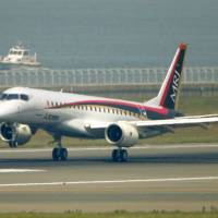 The Mitsubishi Regional Jet is set to head to the U.S. this month for test flights there. | KYODO