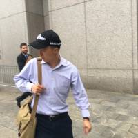 Kun Shan Chun, an FBI employee who pleaded guilty in federal court to having acted as an agent of the Chinese government, is pictured in New York City Monday. | REUTERS