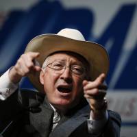 Former U.S. Interior Department Secretary Ken Salazar gestures in 2014 while speaking in support of the re-election of now-former U.S. Sen. Mark Udall, in Denver. The Hillary Clinton presidential campaign announced Tuesday that Salazar, a former Colorado senator, would chair her White House transition team. | AP
