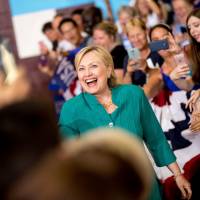 Democratic presidential candidate Hillary Clinton arrives to speak at a rally at Abraham Lincoln High School, in Des Moines, Iowa, Wednesday. | AP