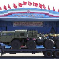 A long-range S-300 missile system is displayed by Iran\'s army during a parade marking National Army Day on April 17 in Tehran. | AP