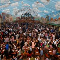 Customers fill a tent after the opening of the 182nd Oktoberfest in Munich, Germany, last September. | REUTERS