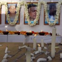 A memorial for 17 slain workers from the French aid group Action Contre la Faim stands in Batticaloa, Sri Lanka, Aug. 11. | REUTERS