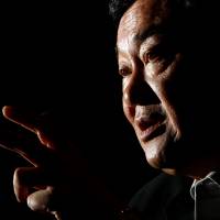 Former Thai Prime Minister Thaksin Shinawatra speaks during an interview in Tokyo in August 2011. | REUTERS