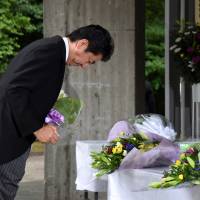 Prime Minister Shinzo Abe prays for the nation\'s war dead Monday at Tokyo\'s Chidorigafuchi National Cemetery, which houses the remains of unidentified Japanese soldiers killed overseas. | SATOKO KAWASAKI