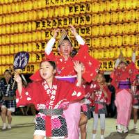 Children and adults perform the Awa odori dance at the Mitama Matsuri festival at Yasukuni Shrine in Tokyo\'s Chiyoda Ward on July 16. | YOSHIAKI MIURA