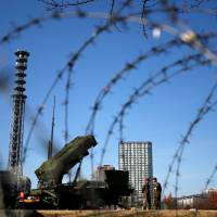 A Patriot missile unit is deployed at the Defense Ministry in Tokyo in December 2012. | REUTERS