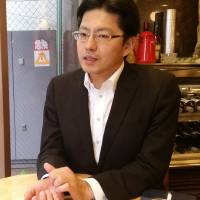Akinori Saito, president of call girl chain Okaasan, says his company takes rigorous measures to prevent employees from sexual disease and stalkers, in an interview in Tokyo on July 23. | TOMOHIRO OSAKI