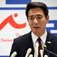 Democratic Party lawmaker Seiji Maehara addresses reporters at the party\'s headquarters in Tokyo on Friday. | SATOKO KAWASAKI