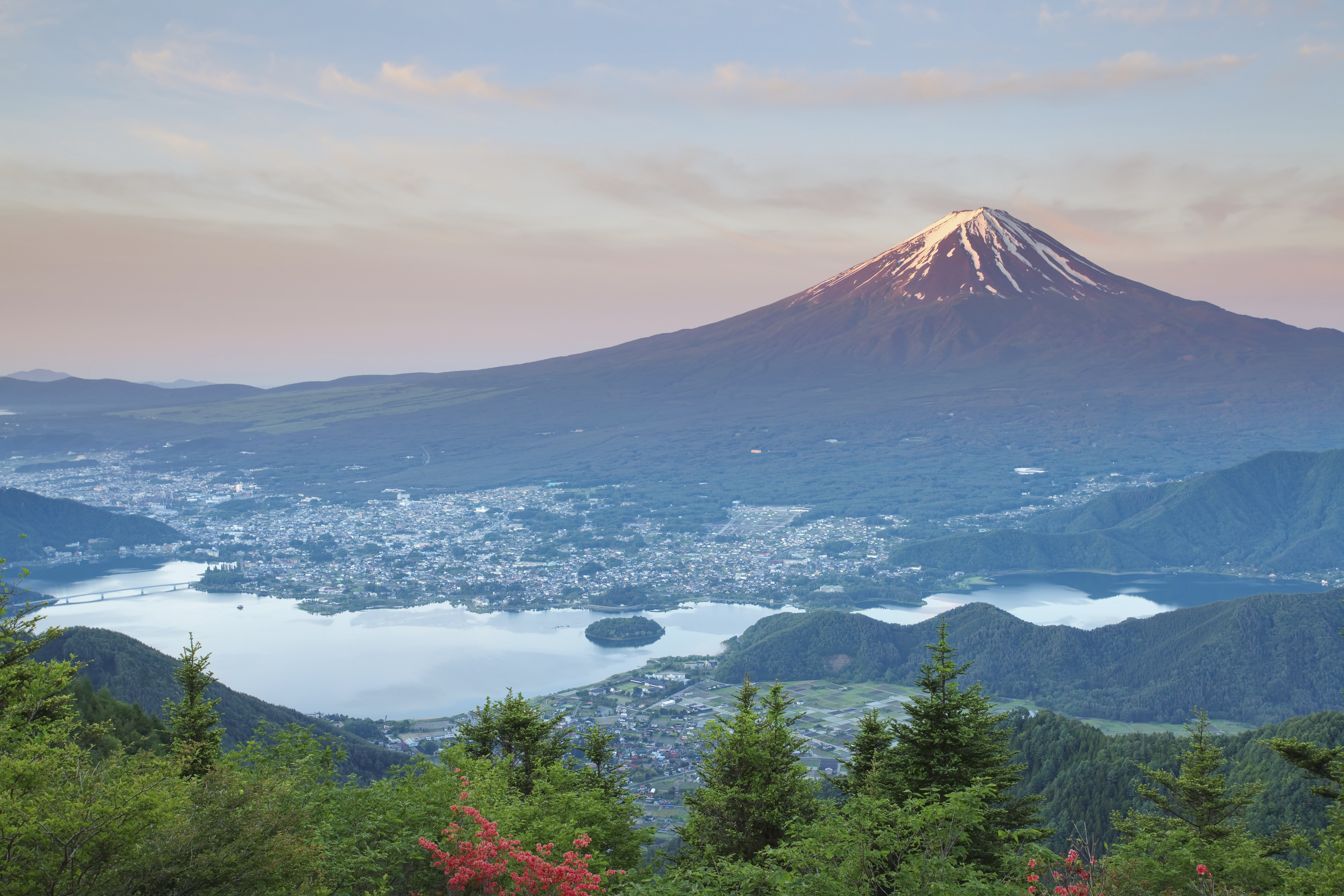 Mount Fuji and Lake Kawaguchiko are seen on a summer day. Japan celebrates Mountain Day, the newest public holiday, on Thursday. | ISTOCK