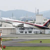 A Mitsubishi Regional Jet takes off Sunday from Nagoya Airport. | KYODO