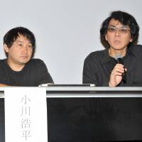 Osaka University professor Hiroshi Ishiguro holds a news conference July 29 at the National Museum of Emerging Science and Innovation (Miraikan) in Tokyo\'s Koto Ward, as Osaka University assistant professor Kohei Ogawa looks on. | YOSHIAKI MIURA