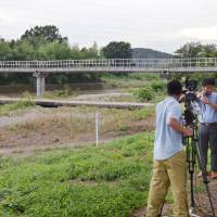 The naked body of a 16-year-old boy was found Tuesday on the banks of the Toki River in Higashimatsuyama, Saitama Prefecture. | KYODO