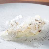 Provocatively monochrome: Sole cooked in a way that evokes three classic Mediterranean fish preparations: baked in salt; cooked in paper; and alla mugnaia (meunière) | RITZ CARLTON HOTEL