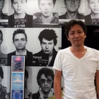 Musical mugs: Creativeman President Naoki Shimizu stands in front of the coolest wallpaper in Tokyo. Summer Sonic founder Naoki Shimizu explains the search for the perfect music festival lineup