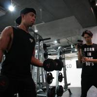 Do you lift?: Shun Kaneko is filmed during a work-out session for his YouTube channel Kanekin Fitness. The 27-year-old swapped cigarettes and alcohol for protein and exercise a while back and used YouTube to help him do it. | ALISA YAMASAKI