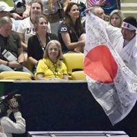 A Japanese fan celebrates the beginning of the Opening Ceremony for the Rio de Janeiro Summer Olympics at the Maracana Stadium on Friday night. | KYODO