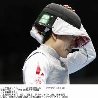 Yuki Ota reacts after losing his preliminary match of the men\'s fencing individual competition on Sunday at the 2016 Rio de Janeiro Olympics. Ota later announced his retirement. | KYODO