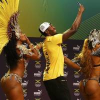 Jamaican track star Usain Bolt dances the samba at a press conference on Monday at the 2016 Summer Olympics in Rio de Janeiro. | REUTERS