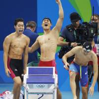 Kosuke Hagino (far left) and his teammates celebrate as they captured the bronze medal in the men\'s 4x200-meter freestyle relay on Tuesday at the Rio de Janeiro Olympics. | KYODO