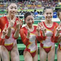 Japanese gymnasts pose for a photo after they finished fourth in the team final at the Rio de Janeiro Olympics on Tuesday. | KYODO