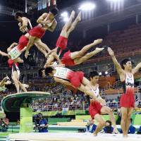 This montage photo shows the performance of Kenzo Shirai in the men\'s vault event final on Monday at the 2016 Rio Olympic Games. | KYODO