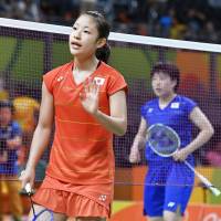 Nozomi Okuhara waves her hand after winning the All-Japan quarterfinal match against Akane Yamaguchi in the women\'s badminton singles on Tuesday at the 2016 Summer Olympic Games in Rio de Janeiro. | KYODO